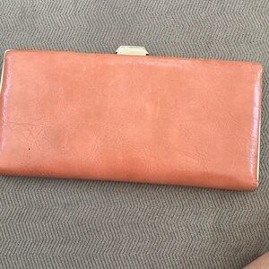 Mundi Slim Wallet holds money or credit cards. Never used. Slight discolor Orang